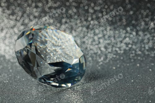 Preview: Beautiful dazzling diamond on shiny glitter background, closeup. Space for text