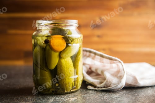 Preview: Pickles in bowl. Tasty preserved cucumbers.