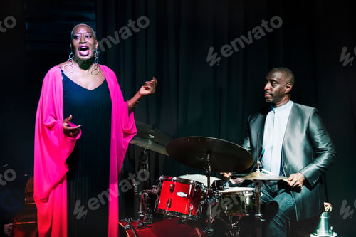 Preview: Drummer and singer performing in an event