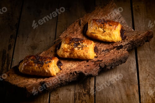 Preview: Chocolate Neapolitans on cork on top of a wooden table