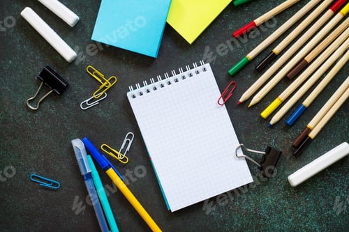 Preview: Back to school background with school supplies, apple on dark concrete or stone background.