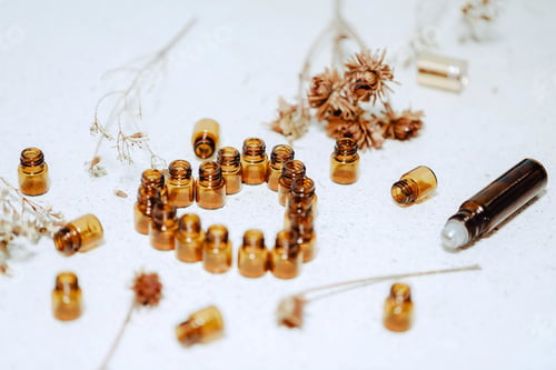 Preview: Top view of small jars forming a heart near dried plants