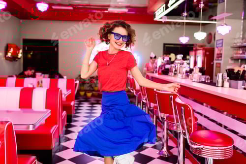 Preview: stylish smiling woman in retro vintage cafe