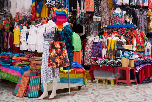 Preview: Pick and choose. Shot of a market stall selling clothes.