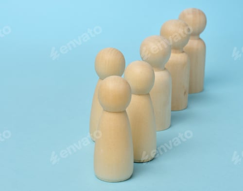 Preview: A row of wooden figures and one out of order on a blue background, concept of uniqueness