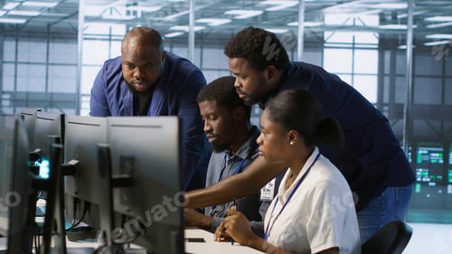 Preview: Teamworking engineers talking in server room, doing brainstorming