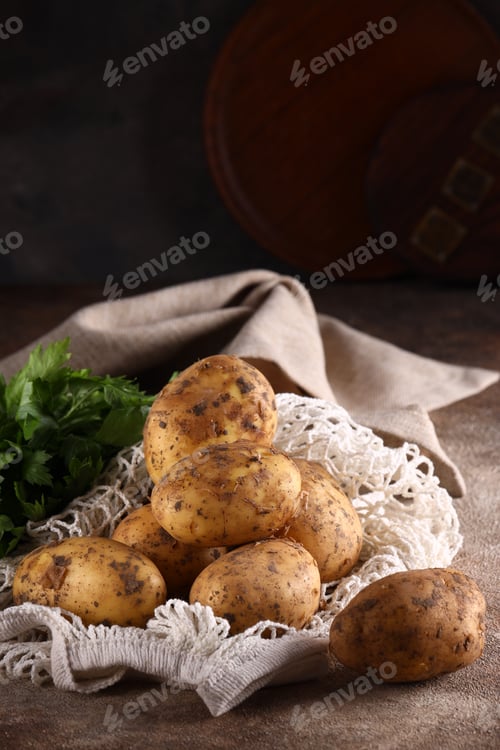 Preview: organic food raw potatoes on the table
