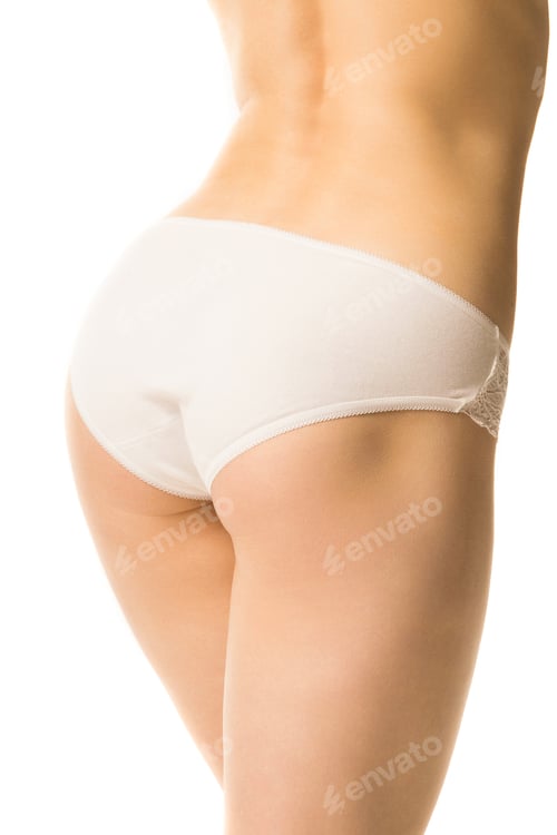 Preview: fit girl in panties on a white background, half-length shot