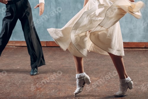 Preview: Ballroom dance. Young couple ballroom dancers. Studio shot