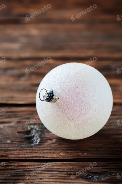 Preview: White christmas balls on the wooden table