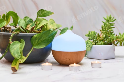 Preview: Aroma oil diffuser on table at home. Aromatherapy concept