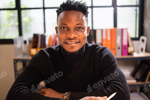 Preview: Portrait of African male creative smile and look at camera in the office