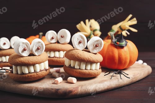 Preview: Delicious Halloween themed desserts on wooden table