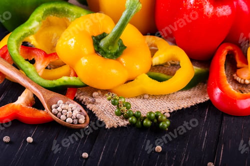 Preview: Three sweet peppers on a wooden background, Cooking vegetable salad