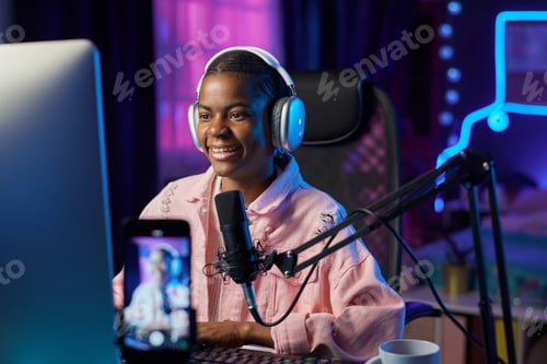 Preview: Girl Wearing Headphones and Playing Videogames