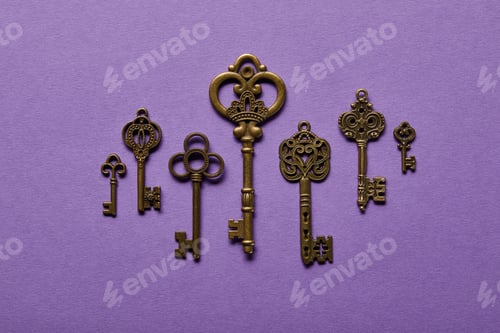 Preview: top view of vintage keys on violet background