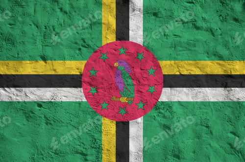 Preview: Dominica flag depicted in bright paint colors on old relief plastering wall close up