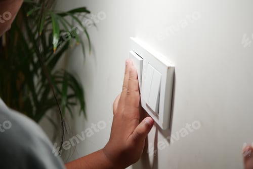 Preview: A young girl is turning off the lights in a calm indoor space