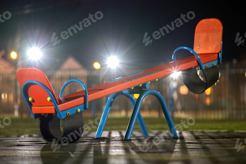 Preview: Seesaw swing in preschool yard with soft rubber flooring at night