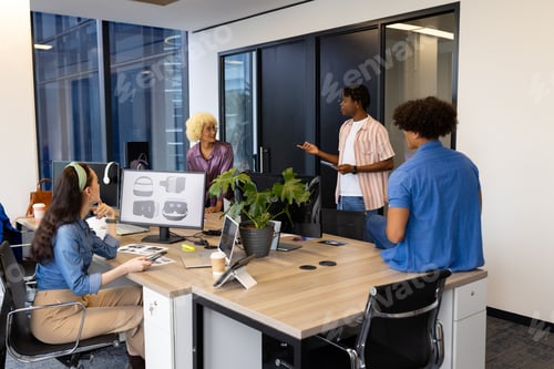 Preview: In modern office, a diverse young team discussing work, African American man leading