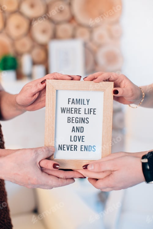 Preview: Three lovely family members hold framed picture