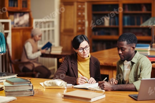 Preview: Professor Teaching in Library