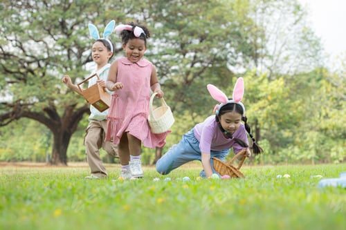 Preview: Children enjoying outdoor activities in the park including a run to collect beautiful Easter eggs.