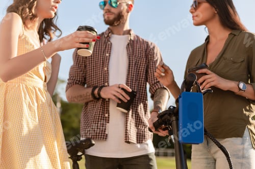 Preview: company of friends having fun together in park listening to music