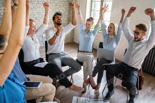 Preview: Entrepreneurs and business people achieving goals, celebrating on team building meeting in office.
