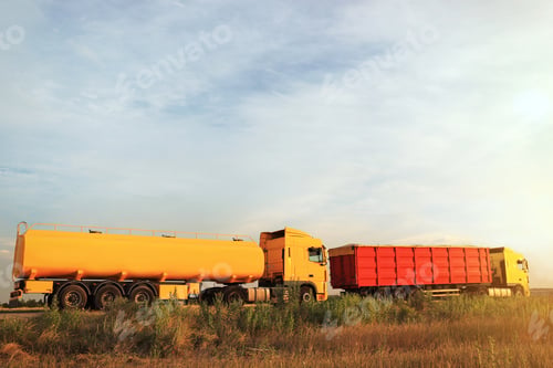 Preview: Modern bright trucks parked on country road