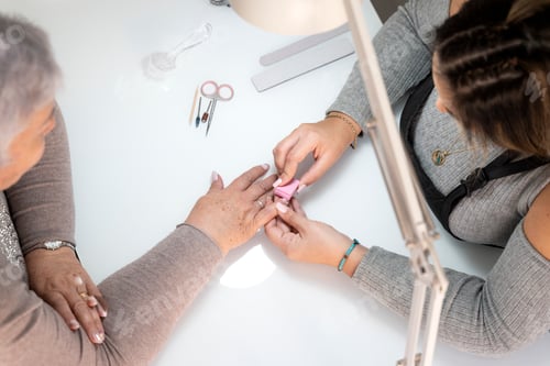 Preview: Esthetician using a buffing block to dehydrate nails