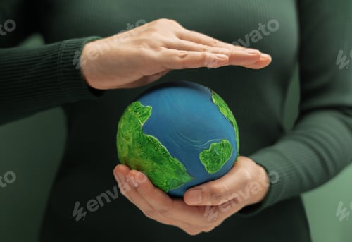 Preview: Hands holding and protecting small globe. Environmental awareness, sustainability