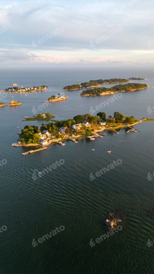 Preview: Vertical aerial shot of Thimble Islands in Branford with a beautiful waterscape and a skyline