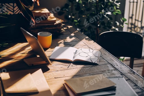 Preview: Close-up shot of working place with sunlight on the rustic desk