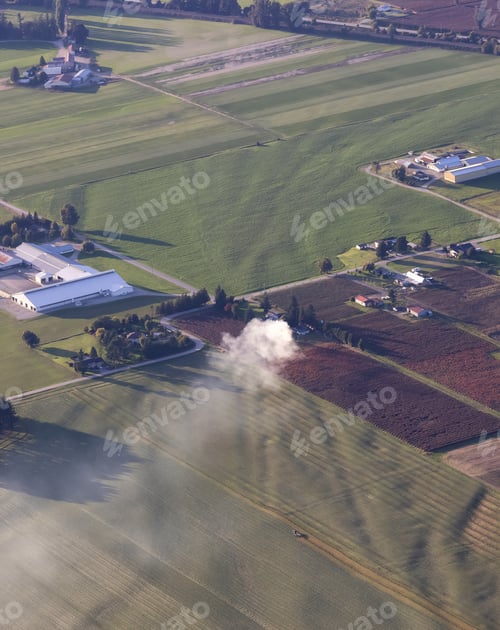 Preview: Aerial View of green Farm Field in Fraser Valley with smoke