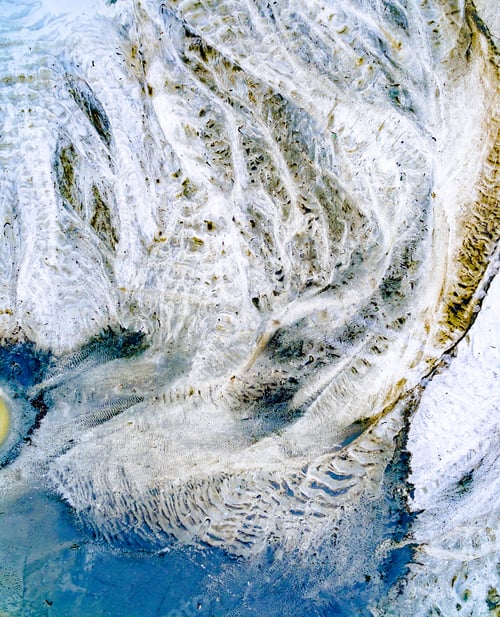 Preview: abstract patterns on the ground from water streams
