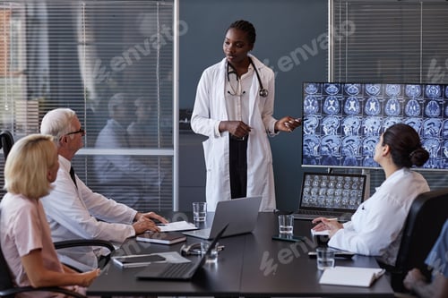 Preview: Female Clinician Giving Report on Analysis of Brain Using MRI Images Indoors