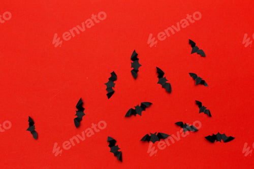 Preview: halloween and decoration concept - paper bats flying