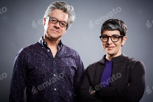 Preview: Studio portrait of mature businessman and woman