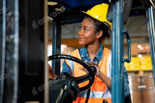 Preview: forklift operator in storage warehouse looking way during transport goods to storage shelf area