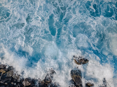 Preview: Rocky beach with Atlantic Ocean waves meeting with underwater sharp rocks.