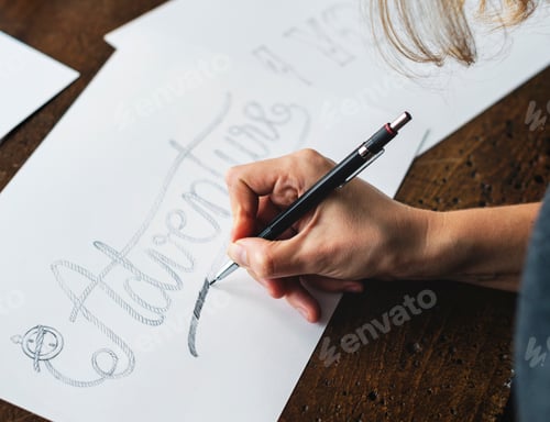 Preview: Closeup of a calligrapher working on a project