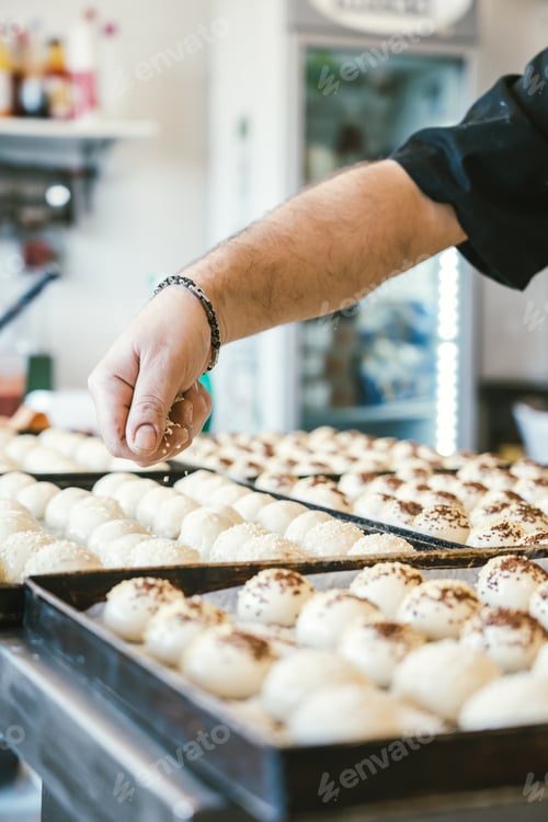 Preview: unrecognizable man cooking buns. Traditional Italian cuisine