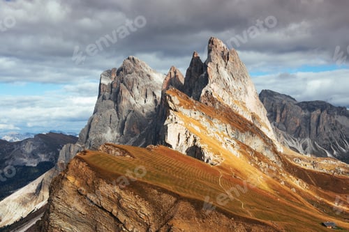Preview: Little house standing on slope. Outstanding hills of the Seceda dolomite mountains at daytime