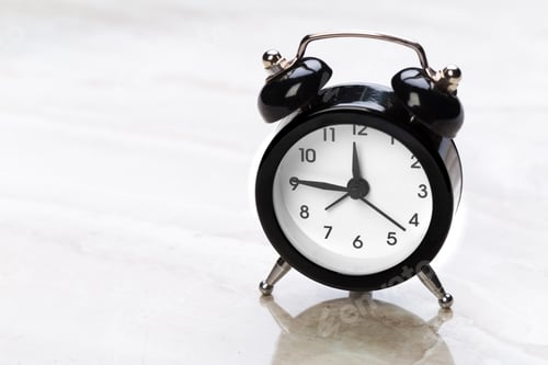 Preview: black vintage alarm clock on color background
