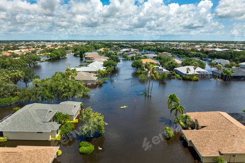 Preview: Flooded residential area with underwater houses from hurricane rainfall