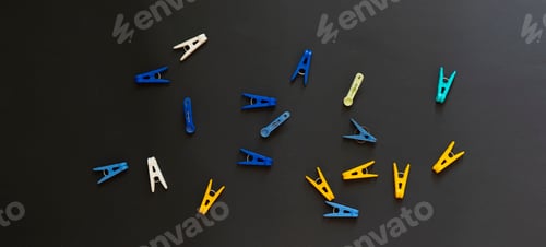Preview: the some bunch of colorful plastic clothespin flat lay on the colorful surface, minimalism style wid