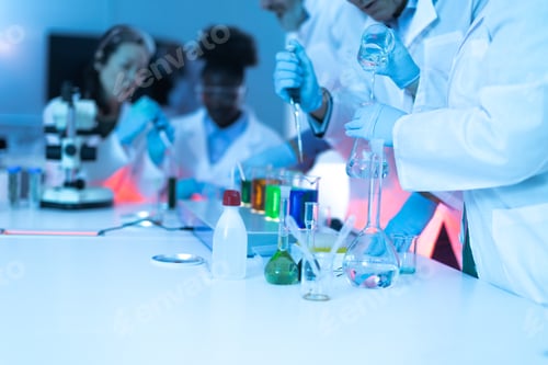 Preview: Scientists conducting laboratory experiment with liquids