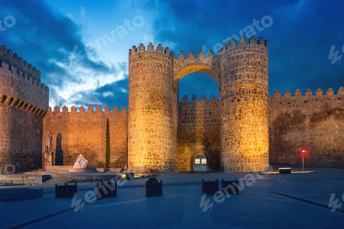Preview: Puerta del Alcazar Gate of Medieval Walls of Avila at night - Avila, Spain