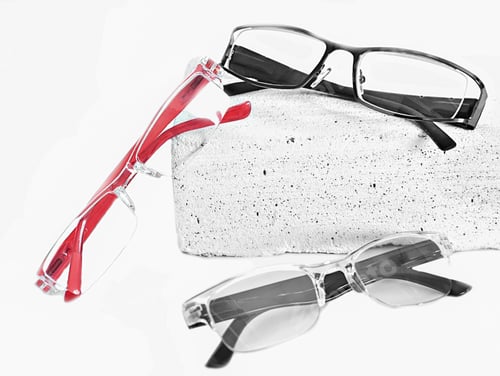 Preview: three various eyeglasses on trendy stone. Optical store, glasses selection, eye test, vision